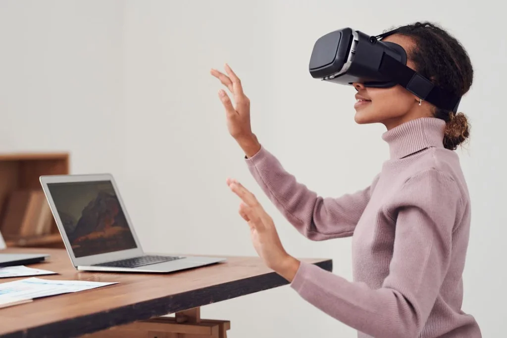 Virtual reality (VR) creates fully immersive digital environments that allow users to interact with simulated spaces as if they were physically present.